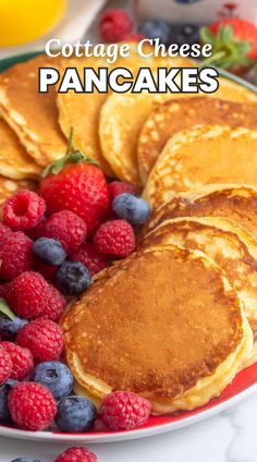 pancakes on a plate with berries and blueberries