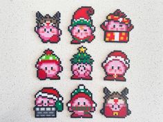 six pixelated christmas characters are displayed on a white surface