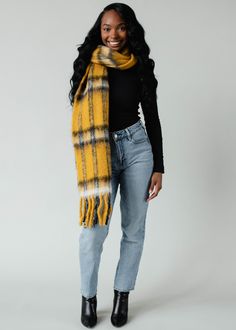 We're all about a fun pop of color during the chilly months! Try our new mustard, white and black cozy scarf with fringe detail to keep you warm and cute all season long. Mustard plaid long scarf Fringe detail  Measures 12" x 72" Designed in the U.S.A. Produced in India.  80% Acrylic / 20% Polyester Mustard Scarf, Scarf With Fringe, Yellow Scarf, Cozy Scarf, Yellow Plaid, Fringe Scarf, Long Scarf, Winter Accessories, Mustard Yellow