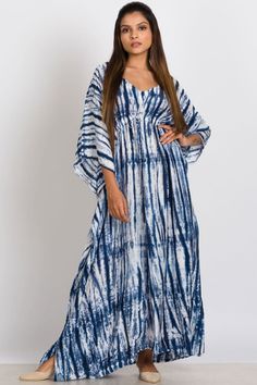 Our Shibori Caftans are made with a luxurious 100% cupro material that is artistically hand tie dyed using the shibori tie dye technique. Women artisans in Western India do the shibori tie dye and the natural cupro material absorbs the colors beautifully. Cupro is a sustainable natural material that is made from the inner filaments of the cotton seed, so these garments have the look and feel of silk, but the breathability and easy care of cotton. These elegant free size caftans feature a drawstring gather at the waist and are designed for a comfortable fit up to XXL size.

Dimensions: 53" Length, One Size Fits Most Jaipur Prints, Cotton Garments, Ladies Design, Style Africain, Shibori Dye, Tie Dye Techniques, Shibori Tie Dye, Woven Shoes, Hand Tie