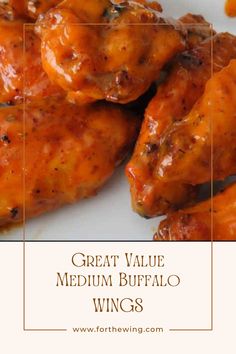 the words great value medium buffalo wings on a white plate