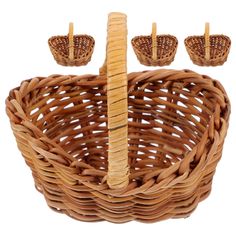 a wicker basket with three pieces of bread in the center and two small baskets on each side