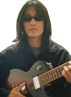 a man with long hair and sunglasses playing an electric guitar in front of a white background