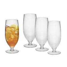 four glasses filled with different types of drinks