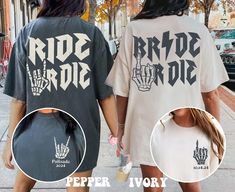 two people walking down the street holding hands and wearing shirts that say ride or die