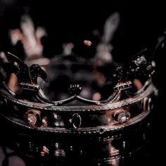 a metal crown sitting on top of a table