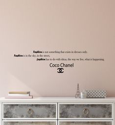 a wall decal with the quote fashion is not something that sits in between us