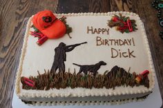 a birthday cake with an image of a man and two dogs