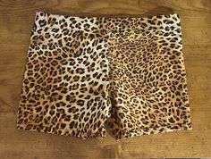 Brown  Dance/Gymnastic/cheer practice shorts in great cheetah print. Made of 4-way stretch spandex fabric.  Full bottom coverage ensures that the shorts won't ride up during  the most aggressive moves.  All Shorts are handmade in the USA and are made to order. If you have specific questions about sizing you can message me and I will do my best to answer any questions you have. I always advise to go by your street size only. Care: Please wash in cold water only on a gentle cycle and lay flat to dry. Wash garment inside out. Summer Cheerleading Stretch Biker Shorts, Summer Stretch Leopard Print Shorts, Stretch Leopard Print Shorts For Summer, Summer Stretch Shorts In Leopard Print, Leopard Print Stretch Shorts For Summer, Brown Stretch Athletic Shorts, Leopard Print Shorts With Built-in Shorts, Stretch Leopard Print Shorts, Cheetah Shorts