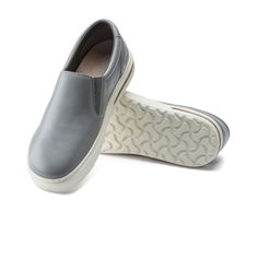 The Oswego Slip On in Gray Leather for Men from Birkenstock. Introducing the BIRKENSTOCK Oswego - the ultimate slip-on shoe for any occasion. Featuring a flexible rubber sole and a one-of-a-kind cork PU midsole for unbeatable shock absorption, these kicks will keep you comfortable no matter where you go. The upper is crafted from top-notch, supple leather for a luxurious feel. Removable, anatomically shaped cork-latex footbed Upper: natural leather Footbed lining: suede Sole: made of natural rub Sporty Shoes, Casual Slip On Shoes, Birkenstock Women, Shearling Boots, Everyday Shoes, Gray Leather, Sneakers Grey, Soft Natural, Grey Women