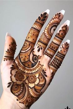 the hand is decorated with intricate designs