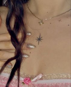 a close up of a person wearing a dress with stars on it's chest