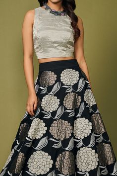 Black skirt with silver floral applique embroidery. Paired with silver top.
Component: 2
Pattern: Embroidery
Type Of Work: Floral
Neckline: Round
Sleeve Type: Sleeveless
Fabric: Silk
Color: Black
Other Details: 
Flared skirt
Note: Necklace worn by the model is not for sale
Occasion: Sangeet - Aza Fashions Elegant Festive Skirt With Resham Embroidery, Long Skirt With Floral Embroidery For Festive Occasions, Elegant Skirt For Diwali Reception, Elegant Silver Lehenga, Festive Long Skirt With Floral Embroidery, Floral Embroidery Lehenga For Evening, Luxury Traditional Skirt With Floral Embroidery, Elegant Skirt With Resham Embroidery For Festive Occasions, Elegant Fitted Skirt With Zari Work