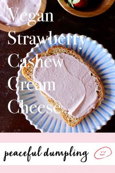 a plate with bread and cream cheese on it next to bowls of strawberries, yogurt and strawberrys