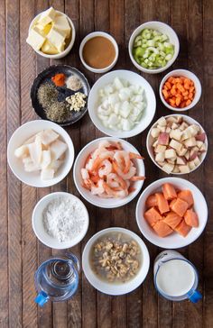 bowls filled with different types of food on top of a wooden table