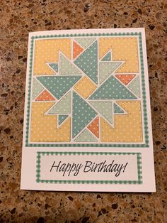 a happy birthday card with an image of a quilted star on the front and bottom