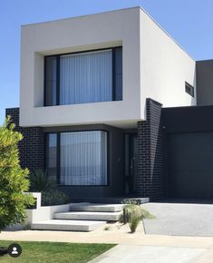 a modern house with black and white architecture