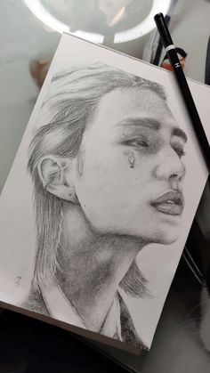 a pencil drawing of a person's face