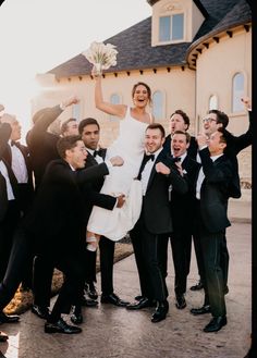 a bride and groom are surrounded by their wedding party