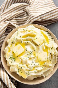 mashed potatoes with butter and parsley in a bowl