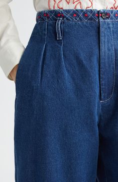 The American luxury label puts its signature artisanal spin on classic wide-leg jeans revamped with colorful geometric embroidery along the waist and hemline. Structured nonstretch denim and trouser-inspired pintucks along the thighs further refine the look. 28 1/2" inseam; 17" leg opening; 13 1/2" front rise; 17 1/2" back rise (size 26) Zip fly with button closure Side-seam pockets; back button-welt pockets 100% cotton Dry clean Imported Designer Clothing Classic Indigo Wide Leg Bottoms, Elegant Wide Leg Dark Wash Jeans, Indigo Wide Leg Jeans For Work, Indigo Wide Leg Flare Jeans, Geometric Embroidery, Denim Details, Pin Tucks, Welt Pockets, Wide Leg Jeans