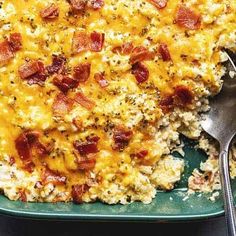 a casserole dish with bacon and cheese on it, ready to be eaten