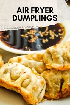 an air fryer dumplings on a plate with dipping sauce