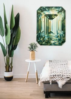 a room with a bed, plant and painting on the wall above it that has an emerald green crystal stone surrounded by leaves