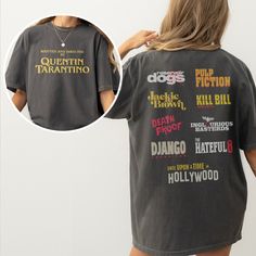 Show your love for one of the greatest movie directors of all time with this Written and Directed by Quentin Tarantino graphic t-shirt that features the text on the front and all of his movie poster logos on the back. The oversized back graphic on the back of this Quentin Tarantino movie t-shirt shows all 9 of his current films including Kill Bill,  Reservoir Dogs, Pulp Fiction, Django Unchained, Once Upon a Time in Hollywood, and more. This retro movie shirt is a unisex fit for men and women an Pulp Fiction T Shirt, Directed By Quentin Tarantino, Graphic Tee Streetwear, Quentin Tarantino Movies, Bills Shirts, Django Unchained, Movie Directors, Reservoir Dogs, Kill Bill