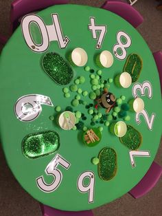 a clock with green and white decorations on it