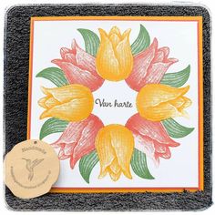 a card with some flowers on it and a rubber stamp that says van harte