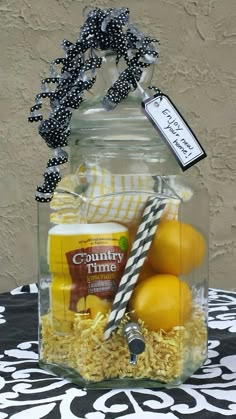 a glass jar filled with lemons and other items