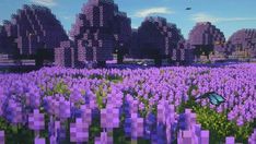 a field full of purple flowers with trees and bushes in the background that are pixelated