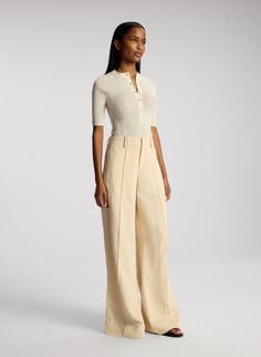 The Colton Pant is crafted from A.L.C's summer suiting fabric in a pampas white hue. This voluminous wide-leg pant features pin tuck front seams with side slash pockets and back welt pockets. Slash Pocket, Jumpsuit And Blazer, Bridal Tops, Short Loungewear, Suiting Fabric, Shop Tops, Wide Leg Linen Pants, Wide Leg Pant, Clothing Essentials