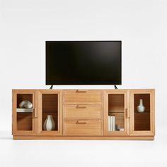 an entertainment center with drawers and a flat screen tv mounted on it's side