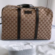 100% Authenticity Guaranteed Gucci Orginial Gg Canvas Carry On Duffle Bag . This Is The Perfect Designer Handbag To Travel With And Has Plenty Of Storage Space. Great Carry On Bag When Traveling By Airplane. This Design Is Very Classy And Traditional. Goes Well With Most Looks And Is Easy To Carry Or Wear Over The Shoulder . Style Name /Code : 449167 Ky9kn 9886 Beige/ Ebony Gg Guccissiama Monogram Canvas With Leather Trim Color : Beige/Ebony, Dark Brown Unisex Front Logo Double Leather Handles R Gucci Travel Luggage, Designer Brown Monogram Canvas Luggage, Gucci Luggage Set, Carry On Duffle Bag, Name Code, Gucci Luggage, Gucci Travel Bag, Gucci Travel, Liberty Bag