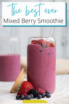 the best ever mixed berry smoothie in a jar with strawberries and blueberries