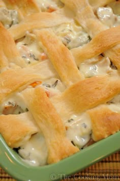 a cheesy bread dish with chicken and cheese