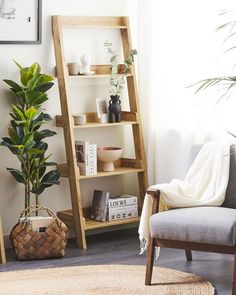 a living room filled with furniture and a tall wooden ladder next to a potted plant