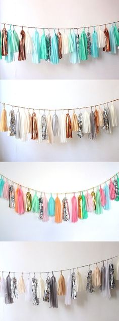 there are many tassels hanging from the clothes line in different colors and sizes