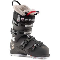 a pair of ski boots with fur on the top and bottom, all in black