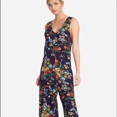 For Effortless Elegance, Look No Further Than This Johnny Was Calme V-Neck Jumpsuit. On Trend Wide Leg Fit, Subtle V- Neckline, Fresh Floral Print. Purple And Black Background French Terry Cotton/Modal/Spandex Blend Absolutely Gorgeous- Sold Out Last Season Size Xl Pit To Pit- 23’ Length Underarm To Hem-45” Inner Seam- 24” New With Tags From A Smoke Free Home Msrp 228.00 Purple And Black Background, Gold Jumpsuit, Purple Jumpsuit, Embroidered Jumpsuit, Silk Jumpsuit, Cropped Jumpsuit, Knit Jumpsuit, Effortless Elegance, Sleeveless Jumpsuits