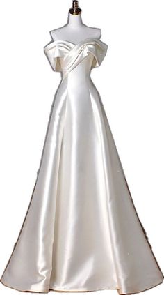 a white wedding dress on a mannequin