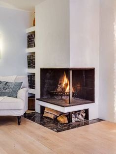 a living room with a couch and fire place