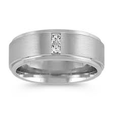 a men's wedding ring with a princess cut diamond in the center and a satin finish