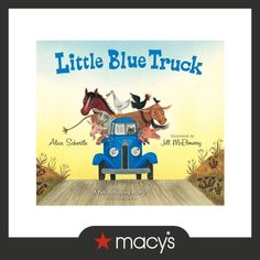 the little blue truck is driving down the road with two horses on it's back