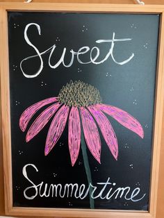 a chalkboard sign with the words sweet, summertime and a pink flower on it