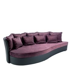 a purple couch with many pillows on it