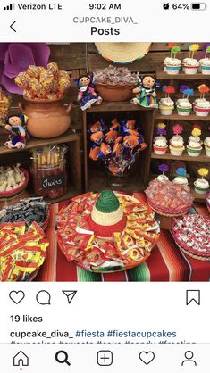 a table filled with lots of cupcakes and other desserts on top of it