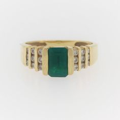 Vintage Emerald And Diamond Ring- 14k Yellow Gold  Size: 4.75 Weight: 3.3 g Stone info:  Emerald: 0.7 Ct  Diamond; 0.3 CTW Contact us for resizing  More pictures available upon request. We offer a risk free 30 - day return policy if you are not completely satisfied, you get your money back! If you are not happy for any reason, return for a full refund less shipping within 30 days.  Vintage items are unique, highly collective, may show light wear but in very good condition. We offer a risk free 3 Green Diamond Channel Set Rings, Classic Green Channel Set Ring, Classic Green Cluster Ring Stamped 14k, Green Diamond Ring With Vvs Clarity In 14k Gold, Formal Yellow Gold Emerald Ring Channel Set, Formal Fine Jewelry Emerald Ring Channel Set, Yellow Gold Channel Set Emerald Ring, Classic Formal Emerald Ring With Channel Set, Formal Emerald Diamond Ring Channel Set